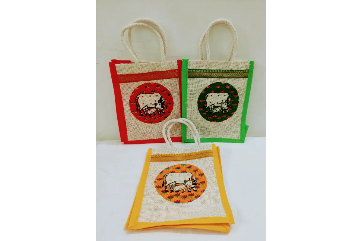 Three small fabric bags with animal designs on a white background