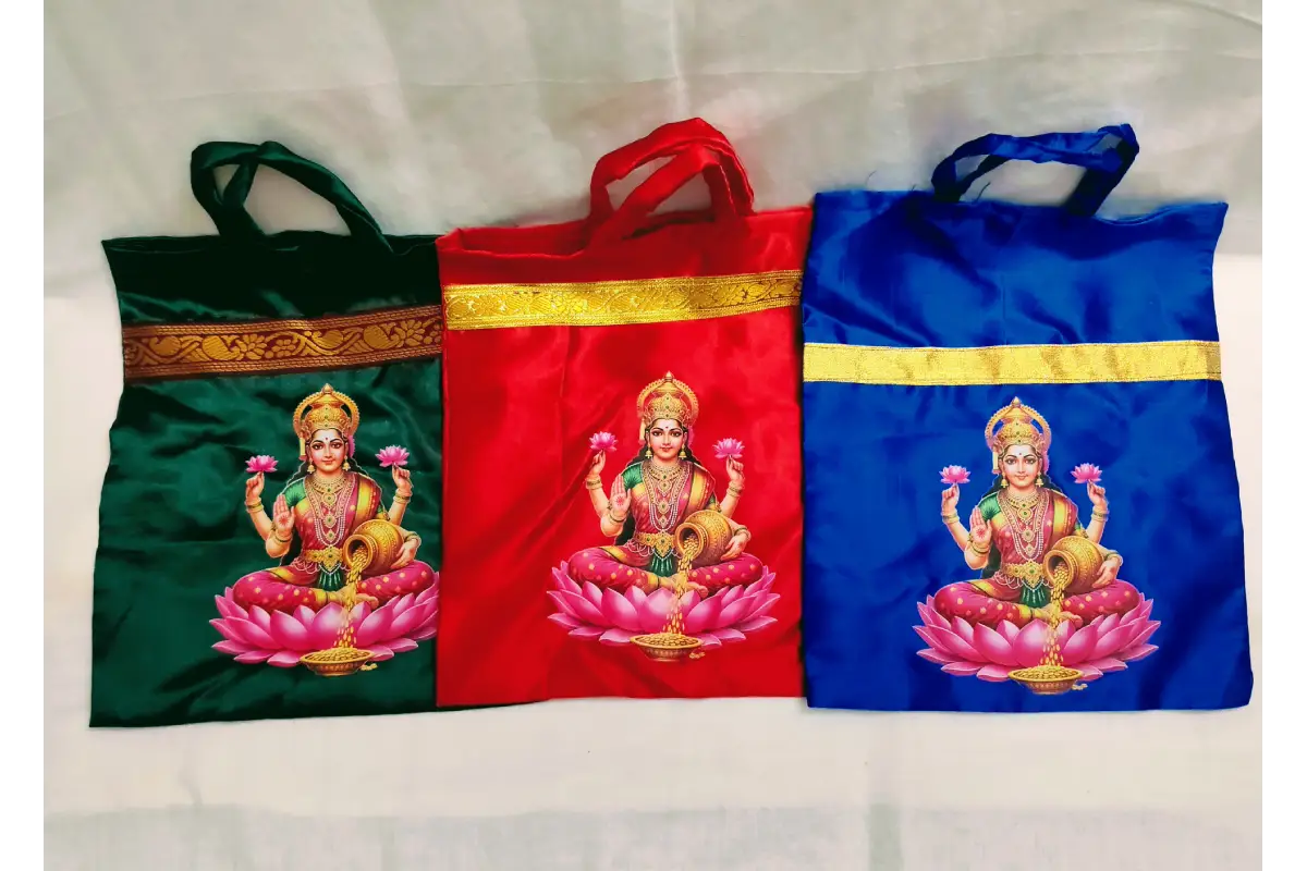 Satin cloth thamboolam bag packed with coconut, blouse bit, and Haldi Kumkum for pooja guests