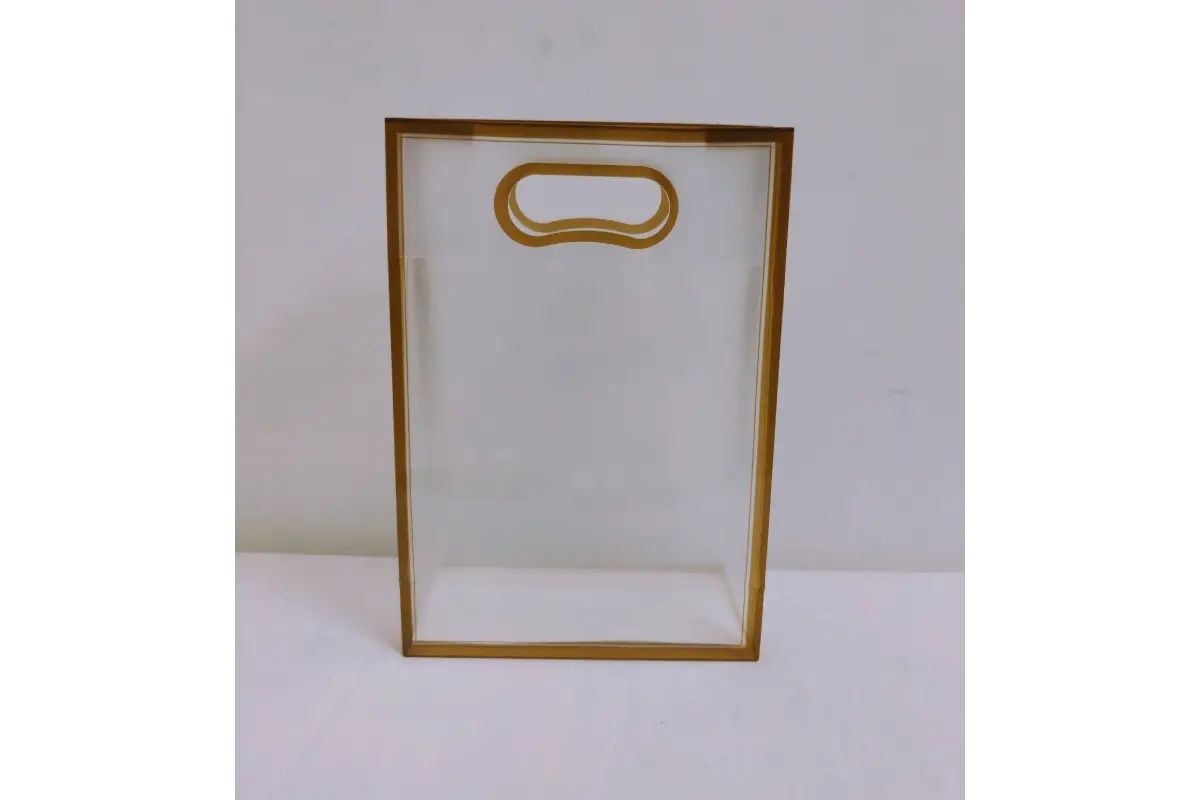 Bottom perspective showing flat wide gusset base of transparent PVC return gift bag