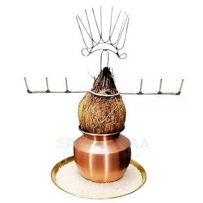 Coconut hanging over a copper container with a white background