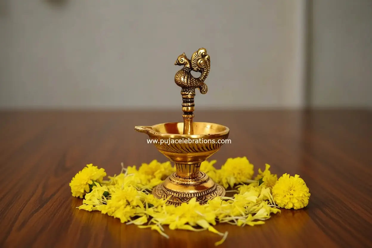 Close up of intricate Annapakshi bird carving on diya