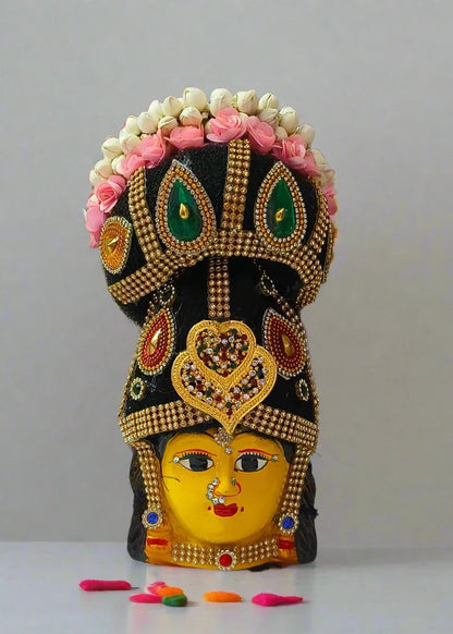 collection of readymade decorated Lakshmi faces with hair buns at wholesale prices from Puja Celebrations