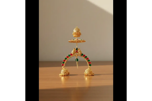 Decorative gold arch with colorful beads on a wooden surface