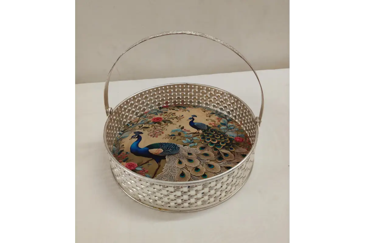 Decorative basket with peacock design on a white surface