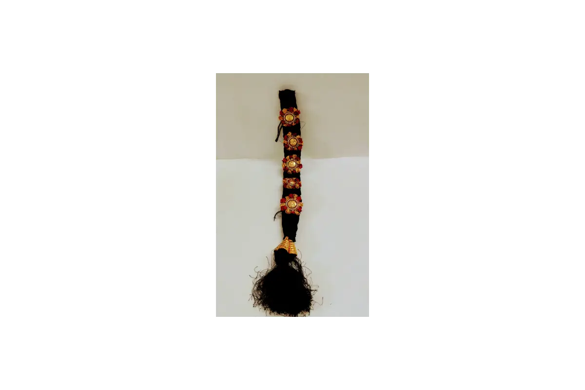 Black guitar strap with floral patterns on a white background