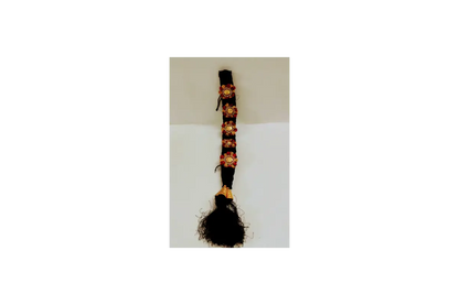 Black guitar strap with floral patterns on a white background