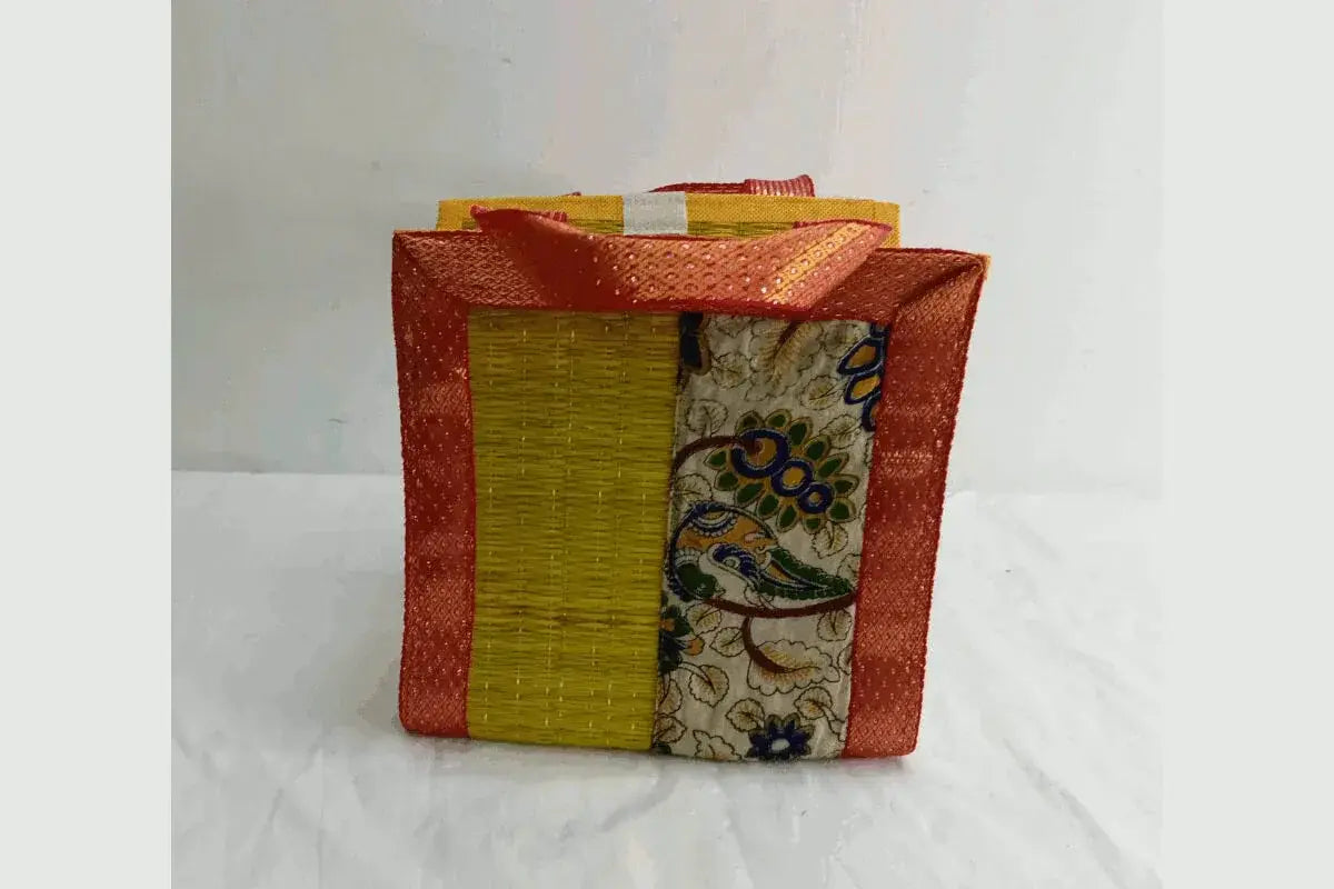 Traditional korai grass bag with Kalamkari fabric for puja gifts