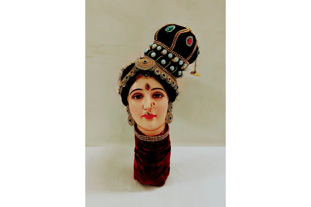 Traditional headpiece with jewelry on a white background