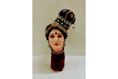 Traditional headpiece with jewelry on a white background