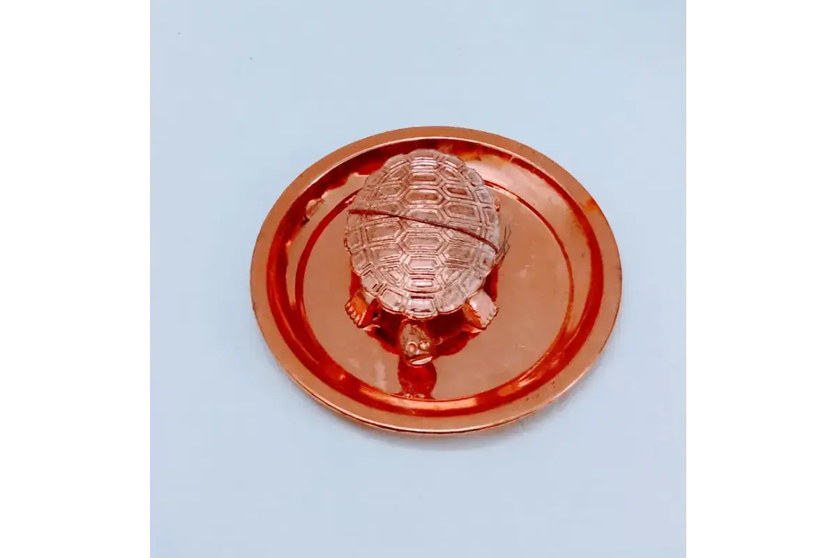 Close up of embossed yantra on metal plate