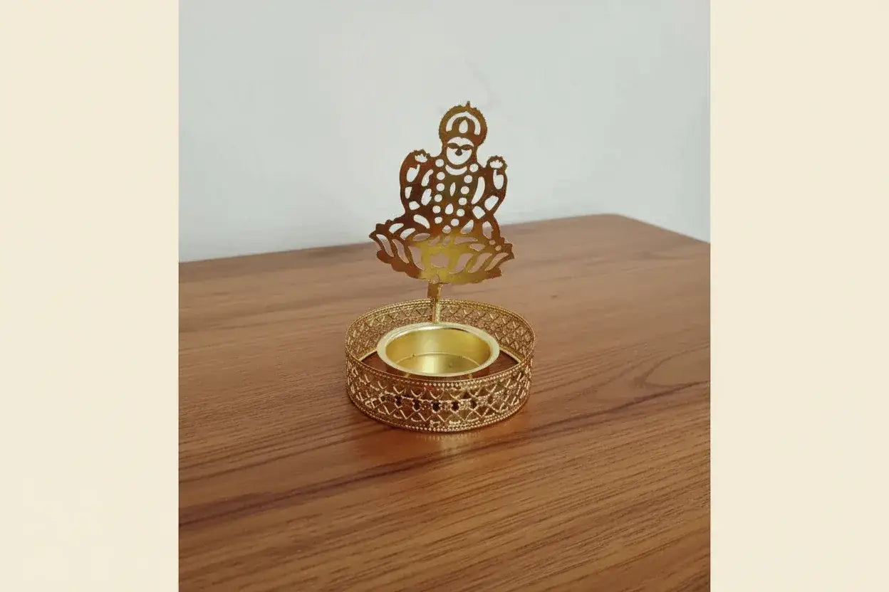 Golden shadow diya with laser cut Ganesha design