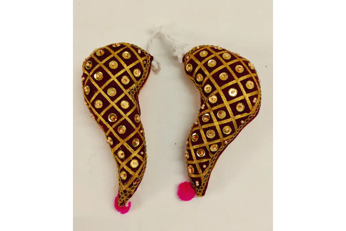 Decorative earrings with gold and brown pattern on a white background