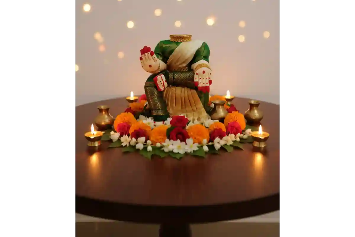 Traditional Devi alankaram stand draped in a saree for Varalakshmi Viratam pooja setup