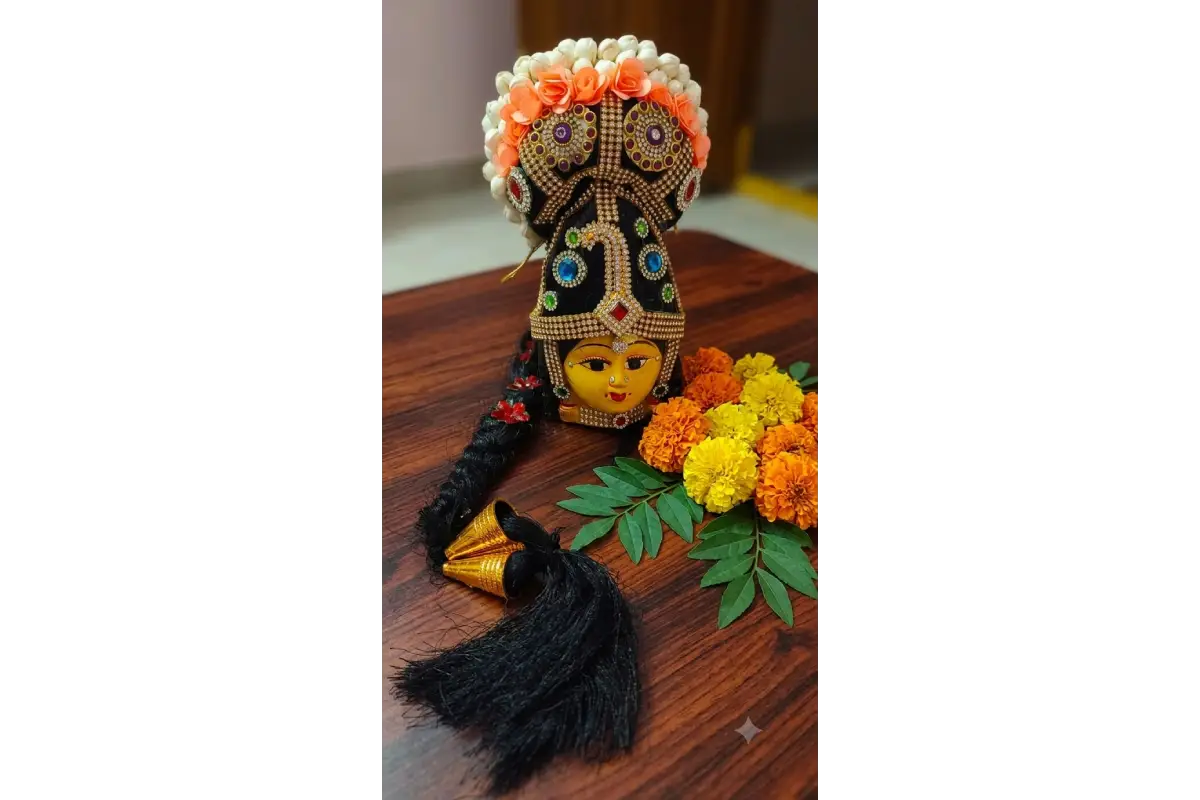 Traditional yellow metal Ammavaru Amman face with traditional kondai hair bun for Varalakshmi Vratham kalash alankara - Puja Celebrations