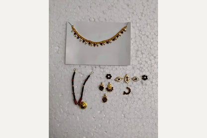 Close-up view of the intricate jewelry and traditional adornments included in the Goddess Devi pooja decoration set - Puja Celebrations