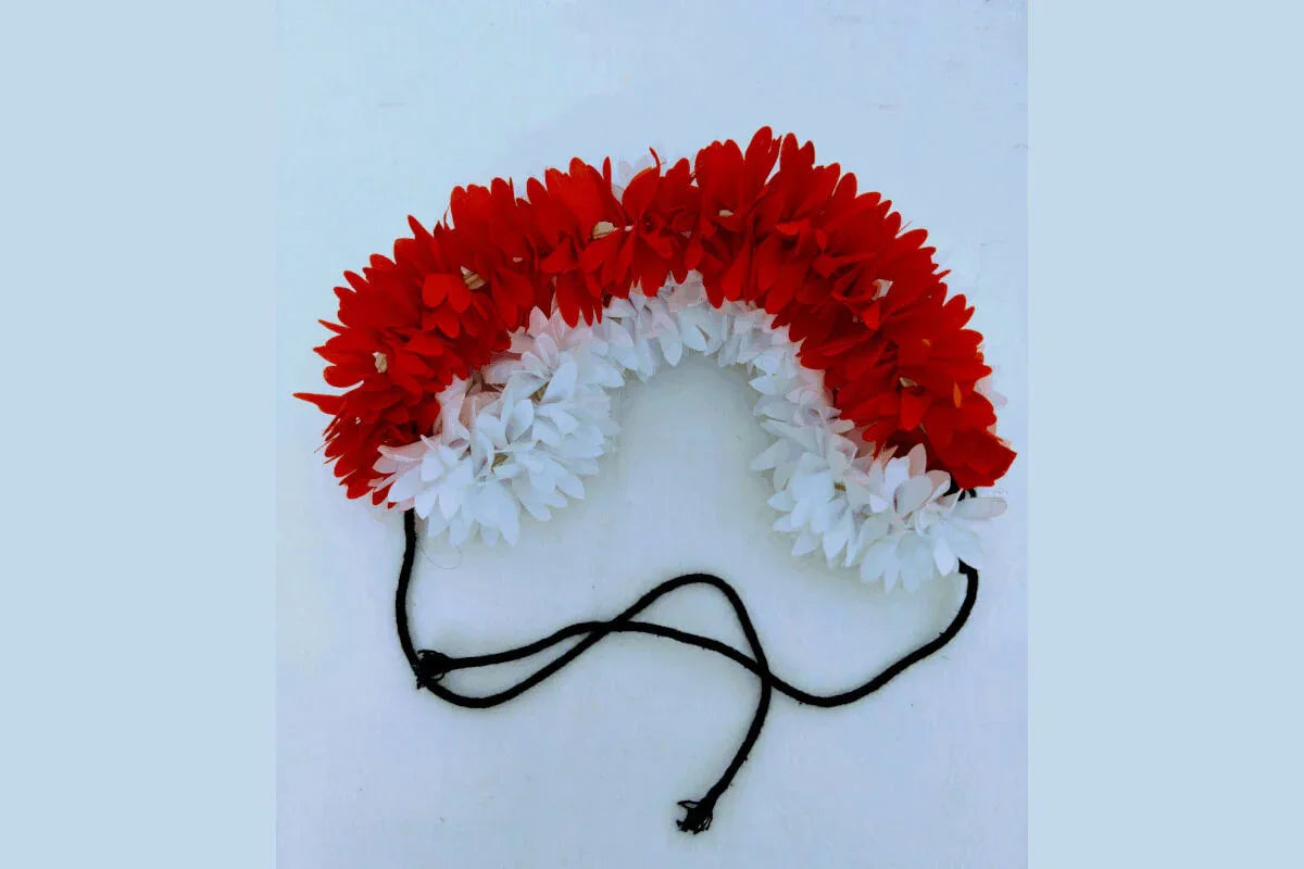 Readymade artificial jasmine flower gajra wrapped elegantly around a traditional South Indian bridal hair bun - Puja Celebrations
