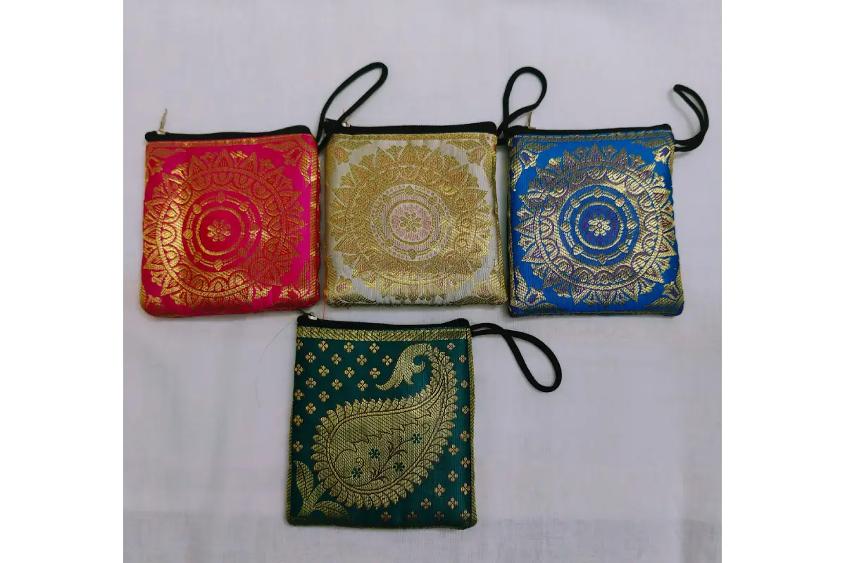 Assorted vibrant color options in silk brocade mini purses available at Puja Celebrations