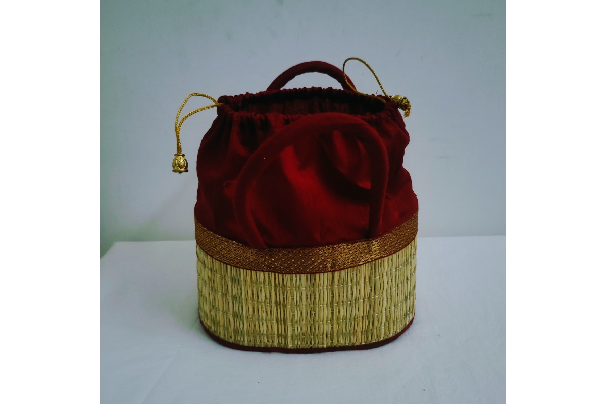 Assorted vibrant fabric trim colors in Korai dry grass potli bags available wholesale