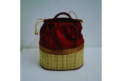 Assorted vibrant fabric trim colors in Korai dry grass potli bags available wholesale