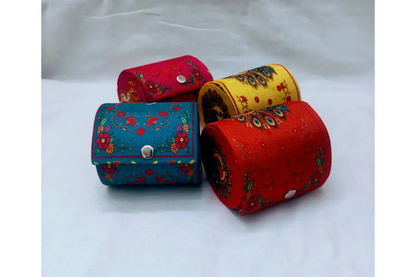 Assorted multi-colored printed fabric bangle boxes available at Puja Celebrations