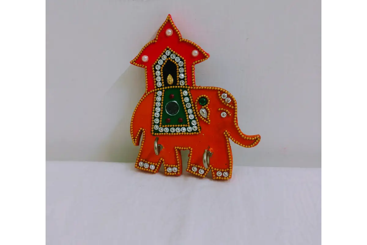 Assorted handpainted color variations in wooden elephant keyholders available wholesale