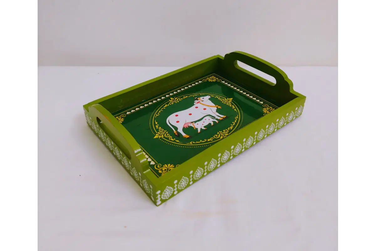 Assorted traditional Pichwai art print variations on handcrafted wooden trays available wholesale