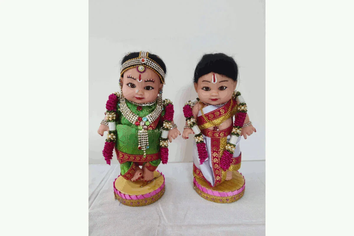 Close-up of Iyengar couple bommai showing the traditional Thiruman namam and 9-yard Madisar saree details- Puja Celebrations