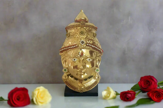 Front view of decorated brass Amman Devi face with traditional stone jewellery  for Varalakshmi Pooja alankaram. - Puja Celebrations