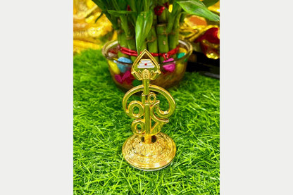 Polished gold finish Tamil Om Vel stand used as a divine accessory for daily rituals