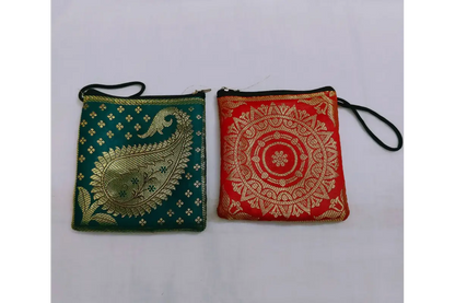 Brocade mini pouch open with coins and gold jewelry showing interior storage capacity