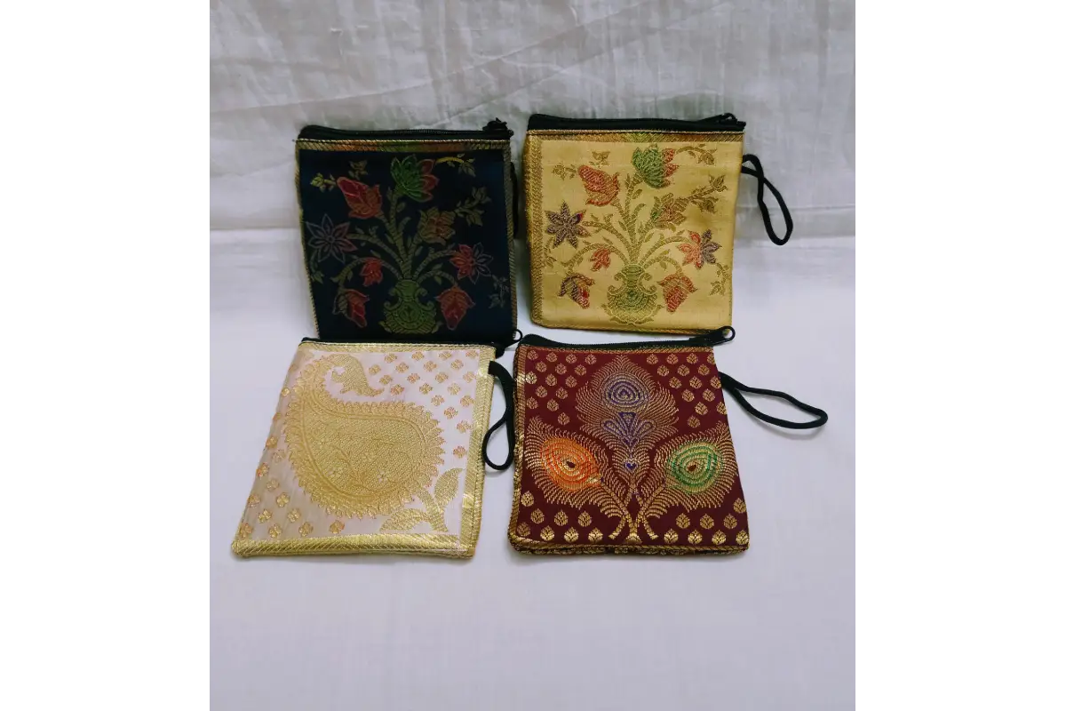 Open brocade mini purse showing smooth inner lining and zipper compartment