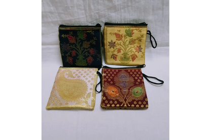 Open brocade mini purse showing smooth inner lining and zipper compartment