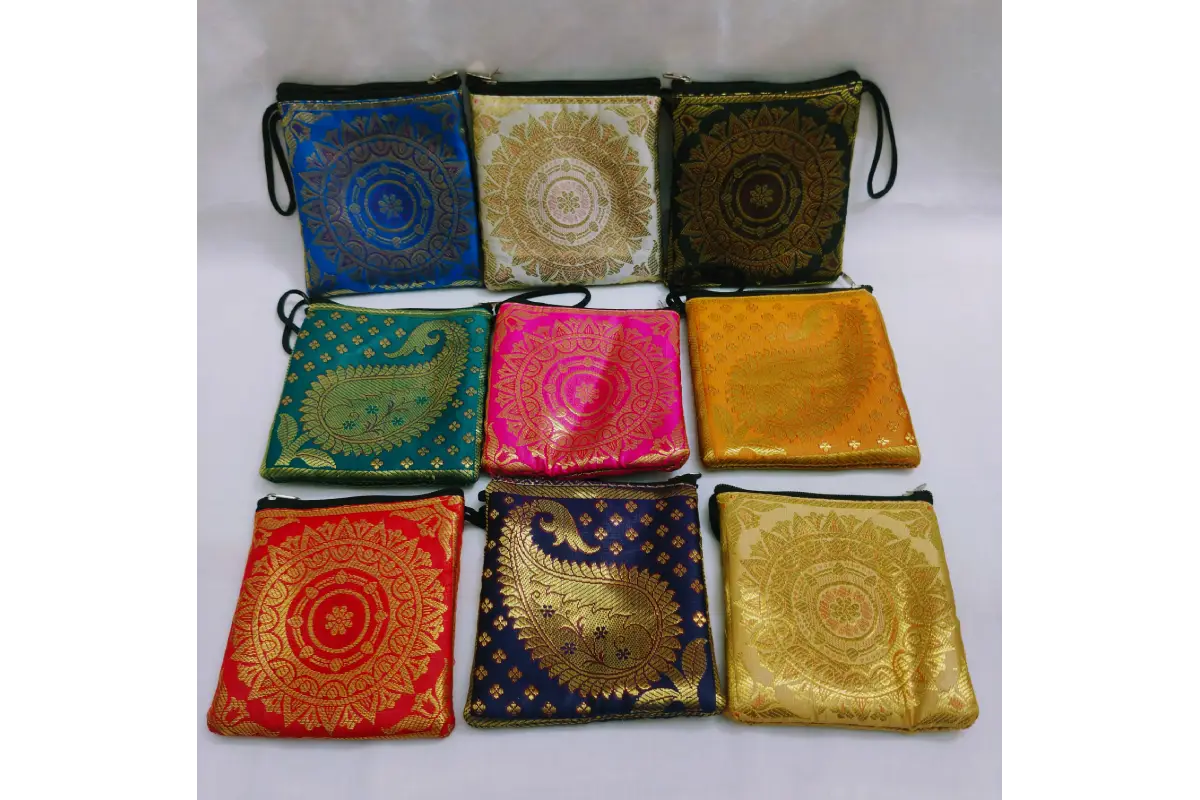Open brocade mini purse showing smooth zipper closure and inner fabric lining