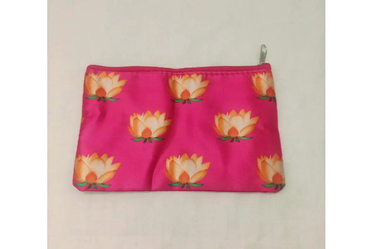 Bulk bundles of Lotus print satin zipper purses packed for wholesale return gift orders at Puja Celebrations
