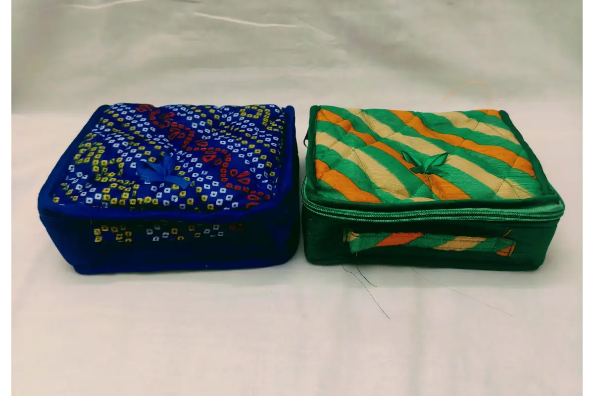 Designer jewels fabric pouch packed with bangles and Haldi Kumkum for housewarming and wedding favors