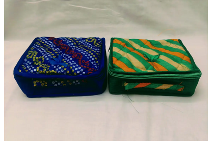 Designer jewels fabric pouch packed with bangles and Haldi Kumkum for housewarming and wedding favors