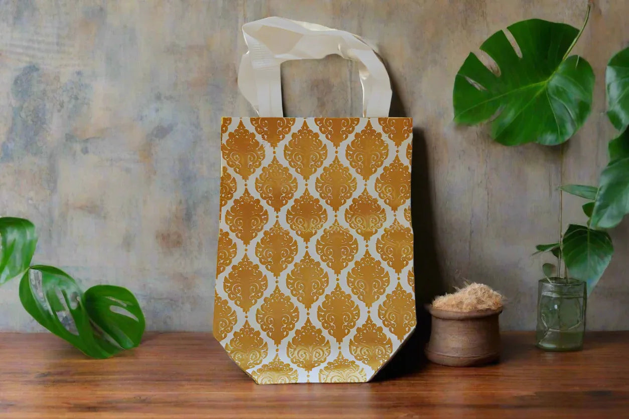 Close up of a glossy sheet paper gift bag with a sturdy rope handle used for thamboolam