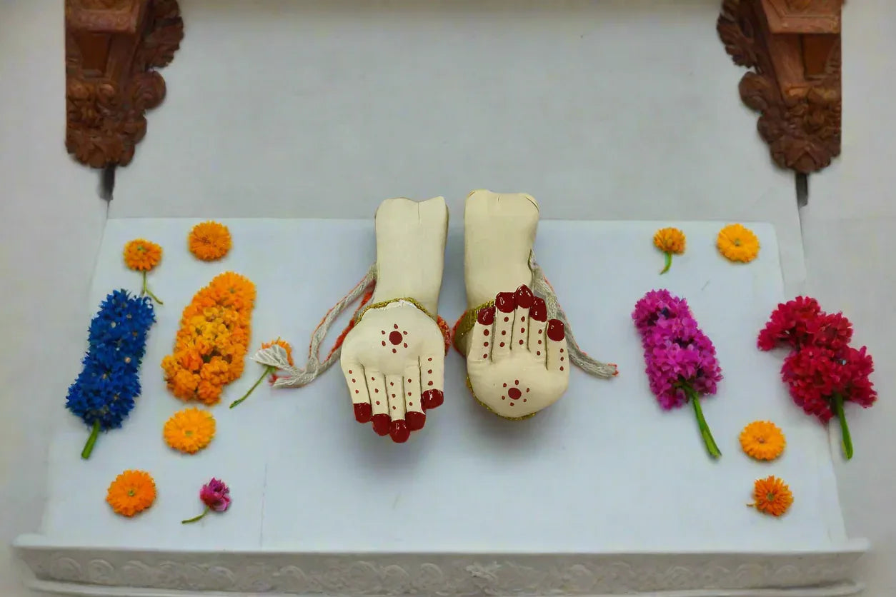 Adjustable fabric Lakshmi Devi hands and legs pinned onto a draped silk saree setup for home puja