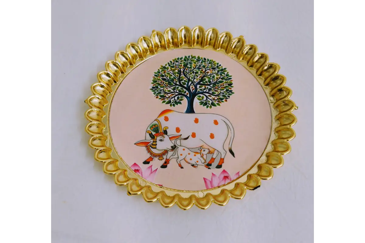 Round fiber plastic plate arranged with coconut and betel leaves for wedding return gifts