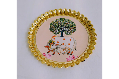 Round fiber plastic plate arranged with coconut and betel leaves for wedding return gifts