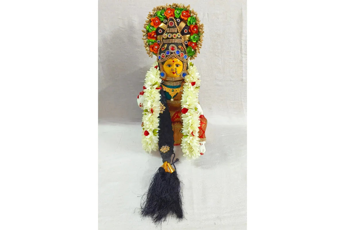 Multiple color variations of assembled Varalakshmi decoration set dolls in Red, Pink, and Yellow sarees- Puja Celebrations