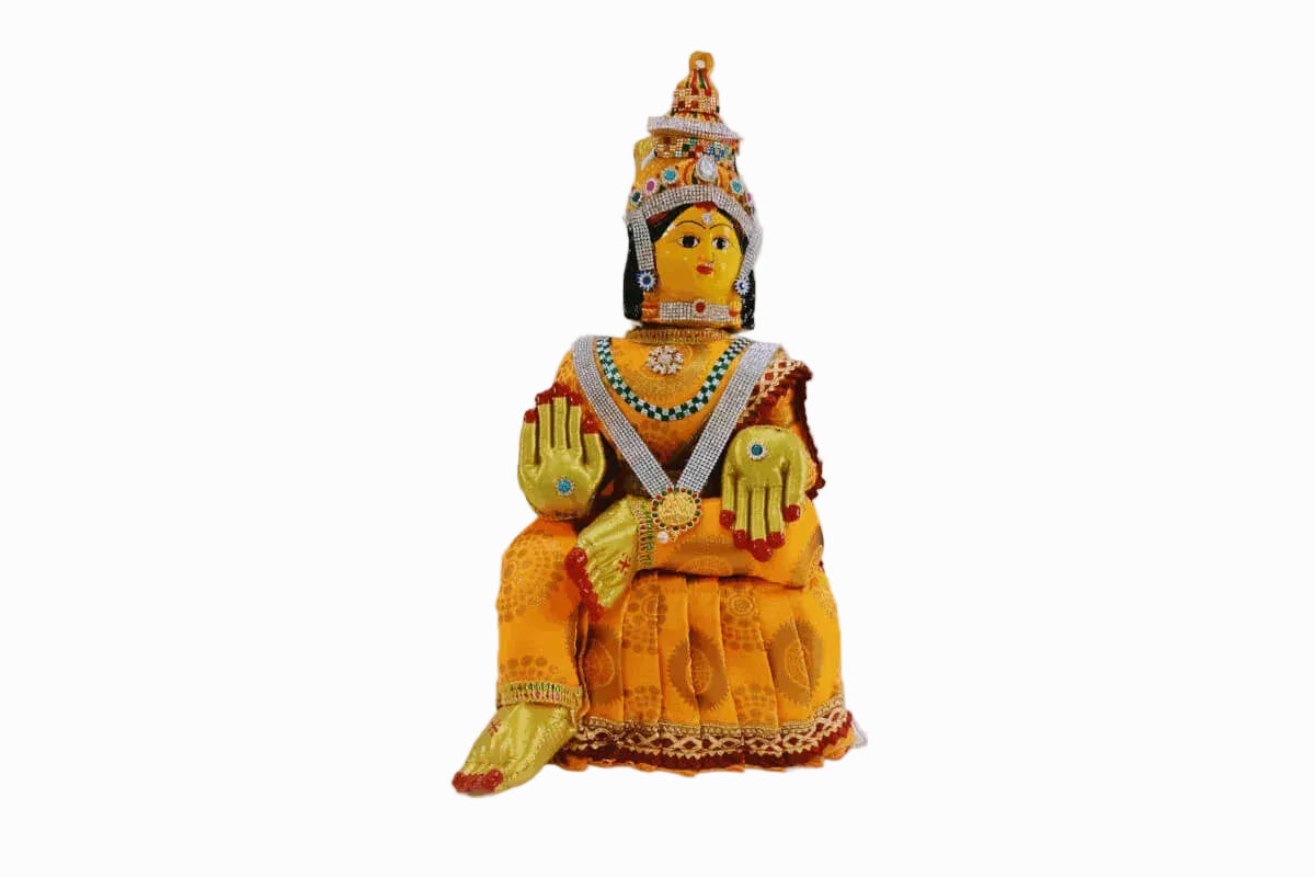 Close up view of the hand-painted metal Varalakshmi Amman doll face mask with stone-studded crown and nose rings - Puja Celebrations