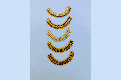 Flat lay view of a gold-plated red and white stone deity necklace showing adjusting threads at the back - Puja Celebrations