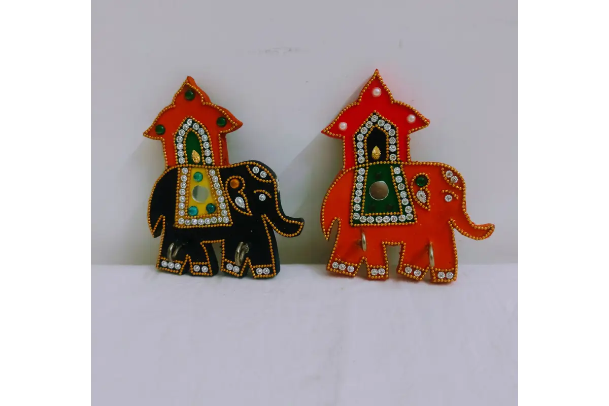 Close-up view of vibrant handpainted ethnic elephant motif and lacquer finish on keyholder