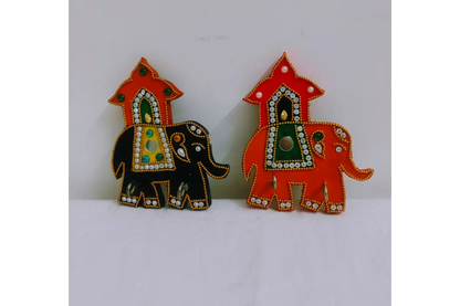 Close-up view of vibrant handpainted ethnic elephant motif and lacquer finish on keyholder