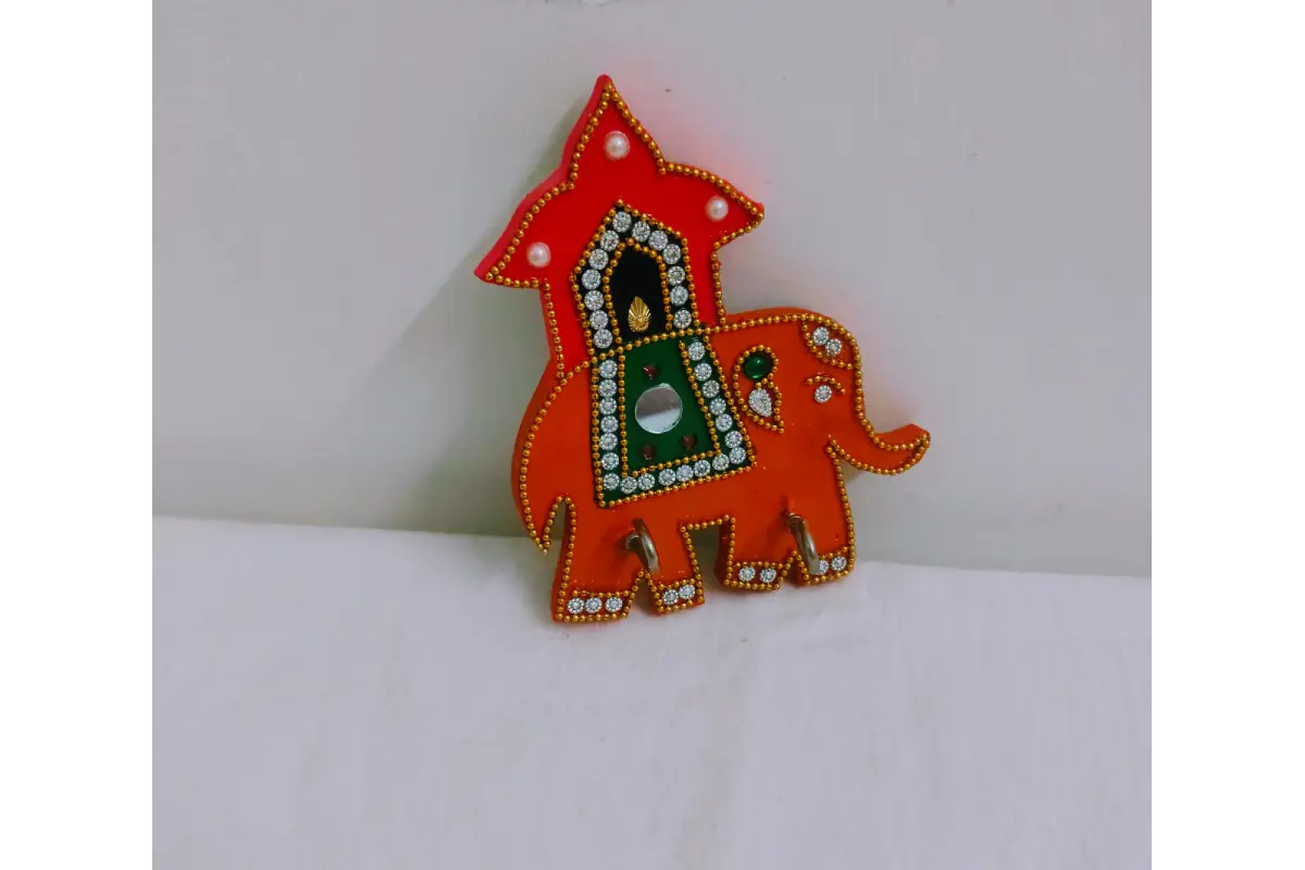 Rear view of wooden elephant keyholder showing pre-fitted wall mounting brackets