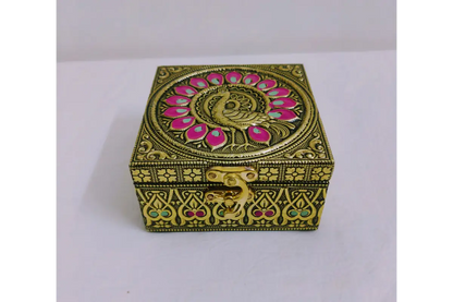 Open embossed jewel box filled with gold jewelry and dry fruits showing storage capacity