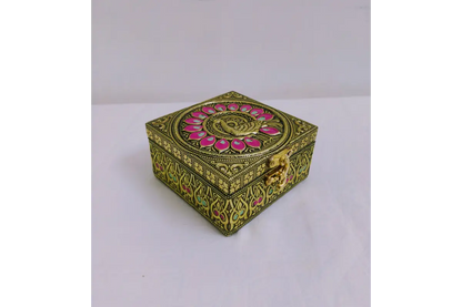 Traditional embossed jewel box held in palm showing compact size for return gifting