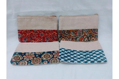 Close-up view of intricate floral Kalamkari print and durable zipper on handcrafted cotton purse