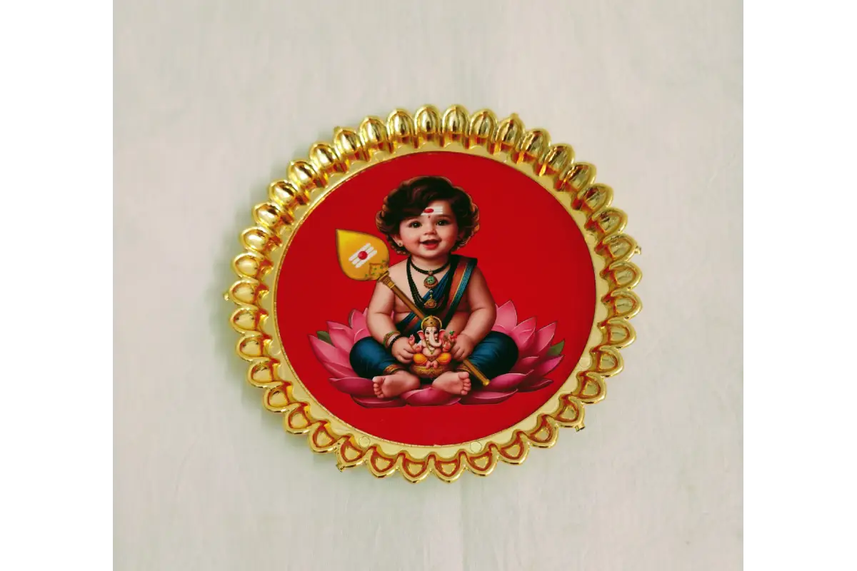 Round fiber plastic thamboolam plate placed near Navaratri Golu stand and marigold flower decor
